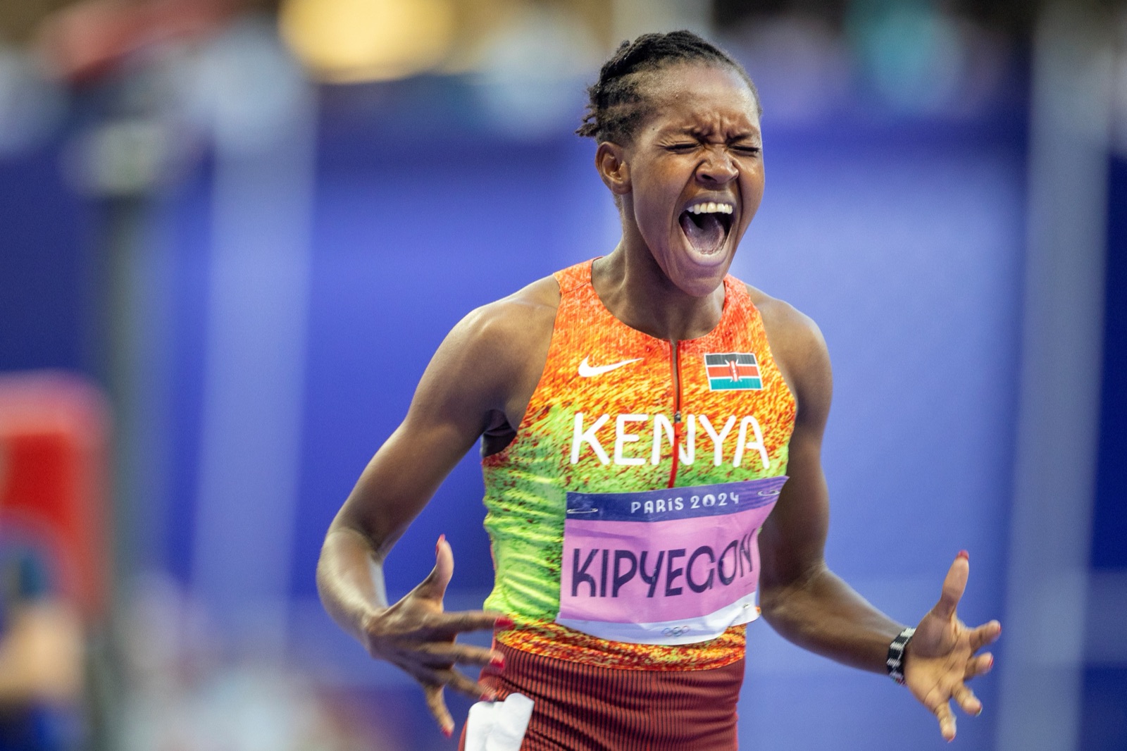Faith Kipyegon celebrating in Kenya kit